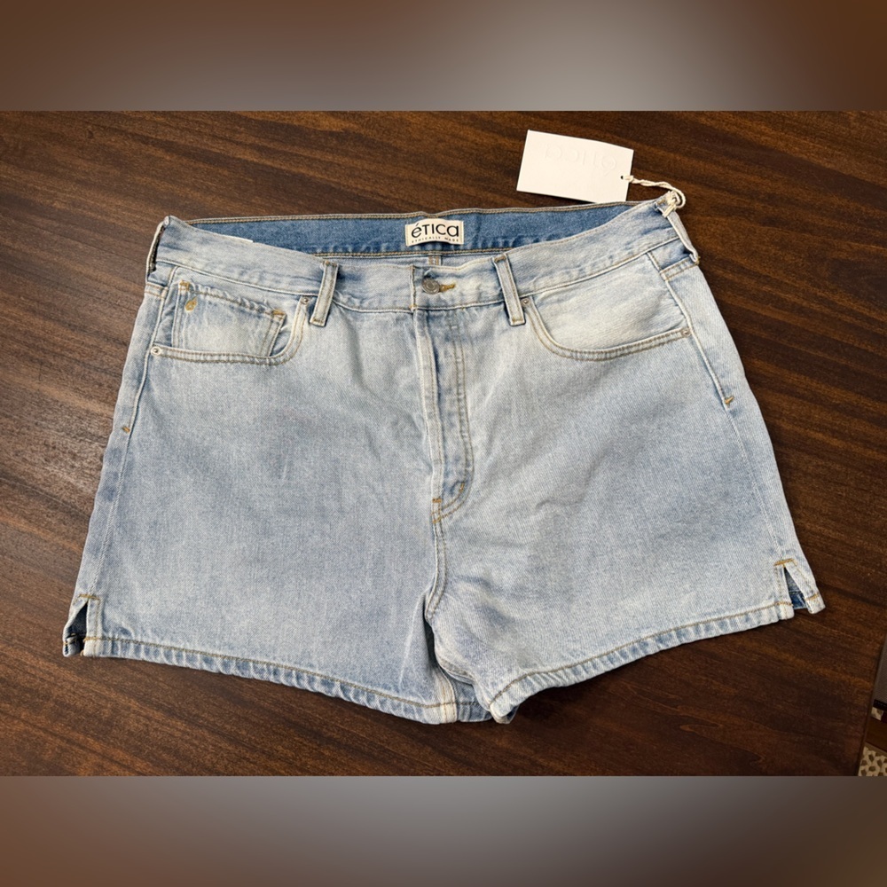 Ética brand light-wash denim shorts featuring side slits and a high-rise fit